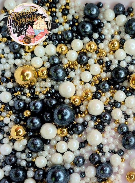 Perlas negras, blancas y oro
